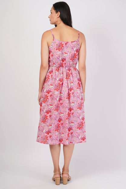 Woman wearing a pink floral dress on a white background